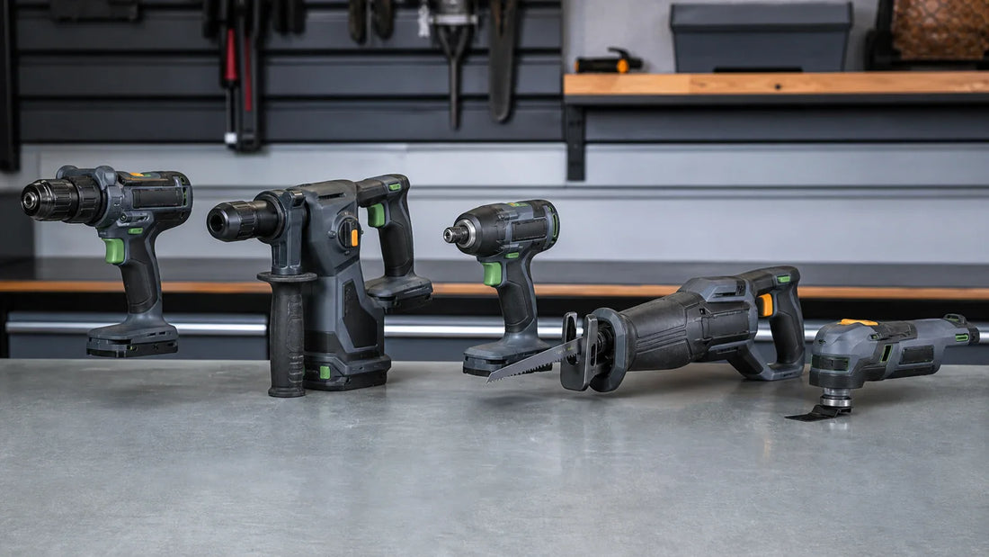 Drill, rotary hammer, impact driver, reciprocating saw, and oscillating tool lined up on a workshop bench.