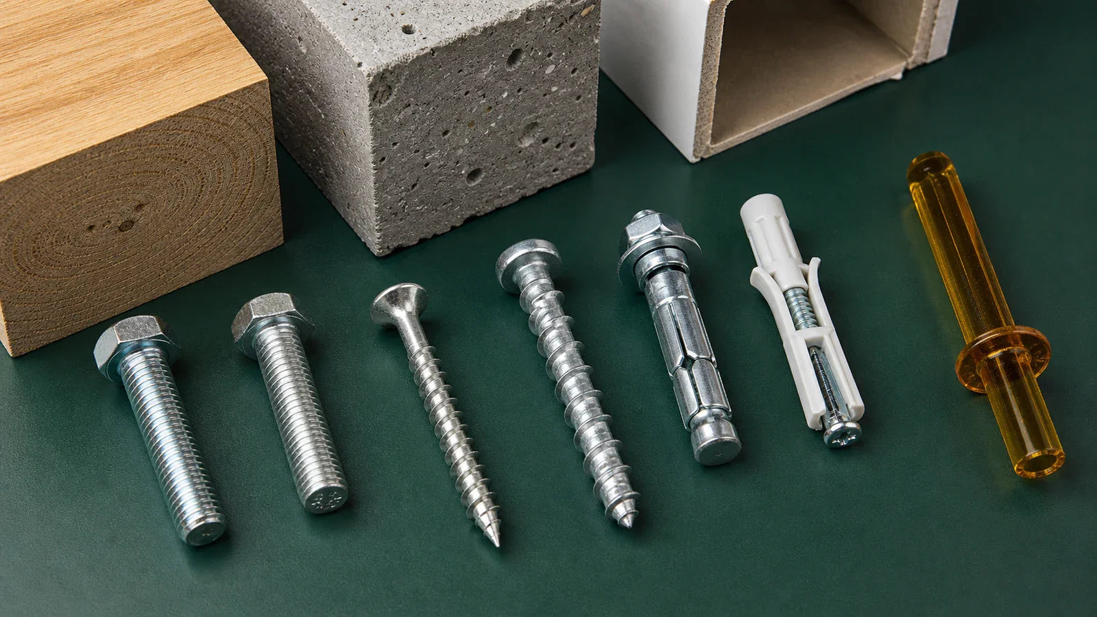 Inch and metric fasteners with several anchor types beside wood, concrete, and hollow-wall samples.