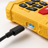 Charging port detail on yellow laser distance measure